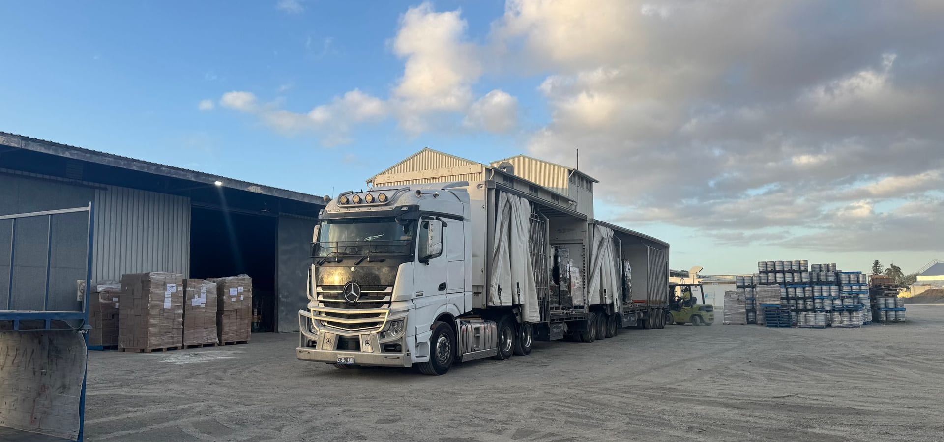 A line of prime movers parked at a depot yard