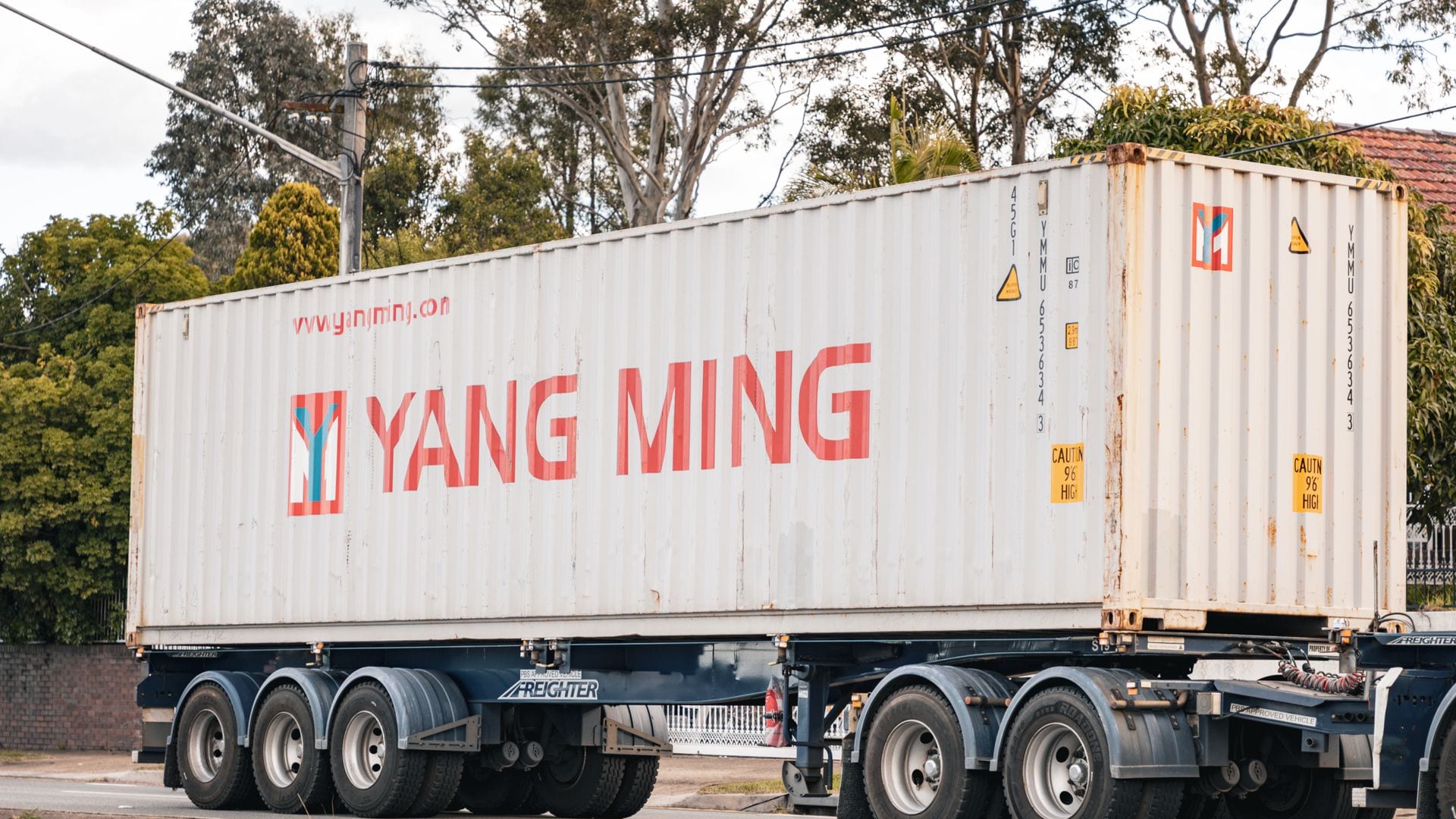 A skel trailer carrying a shipping container